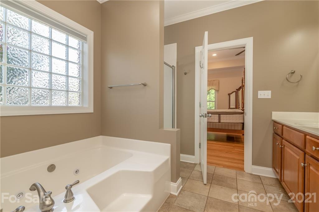 456 Cobblestone Drive Inman, SC 29349 - Photo 26 of 36 a bathroom with a bathtub and a shower