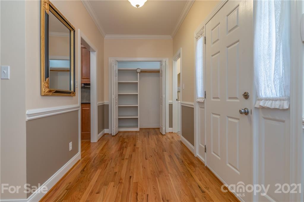 456 Cobblestone Drive Inman, SC 29349 - Photo 6 of 36 a view of a hallway with wooden floor and closet