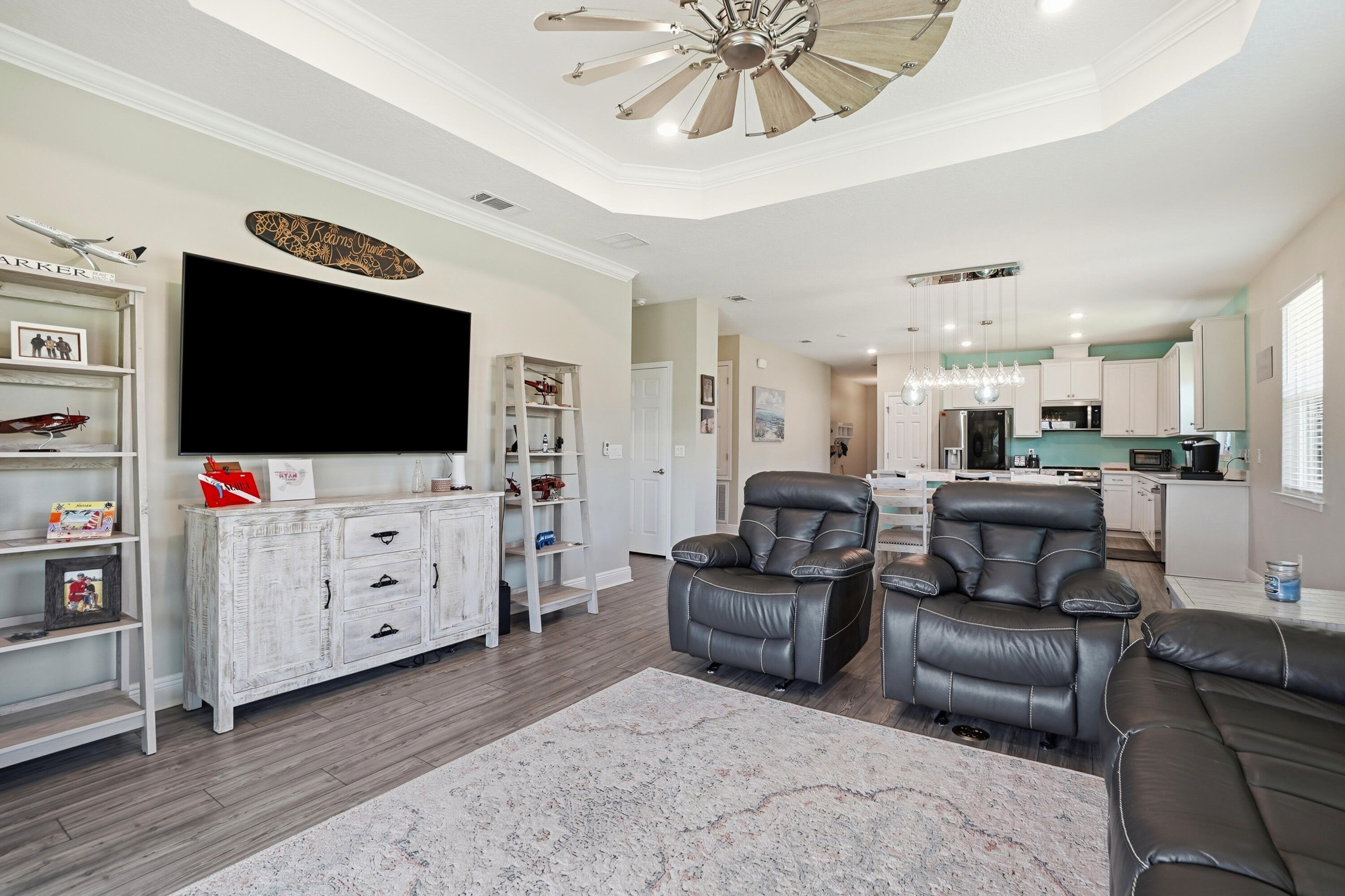 525 Windchime Way Freeport, FL 32439 - Photo 15 of 59 a living room with furniture and a flat screen tv