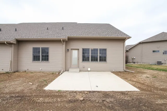 a front view of a house with garage