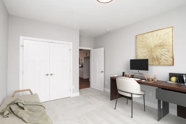 a workspace with furniture and window