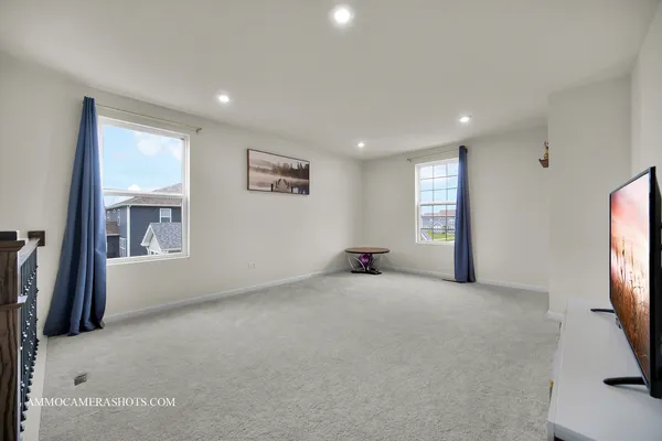 a view of a livingroom with a flat screen tv