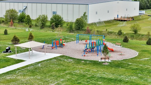 an outdoor space with furniture and garden