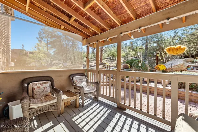an aerial view of residential house with parking and mountain view