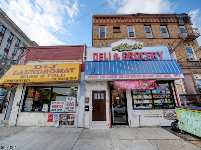 a view of a cafe with sitting area