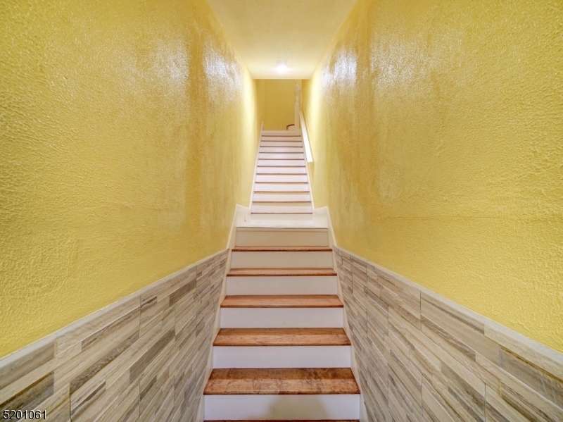 310 Broadway Newark, NJ 07104 - Photo 3 of 11 a view of entryway with wooden floor