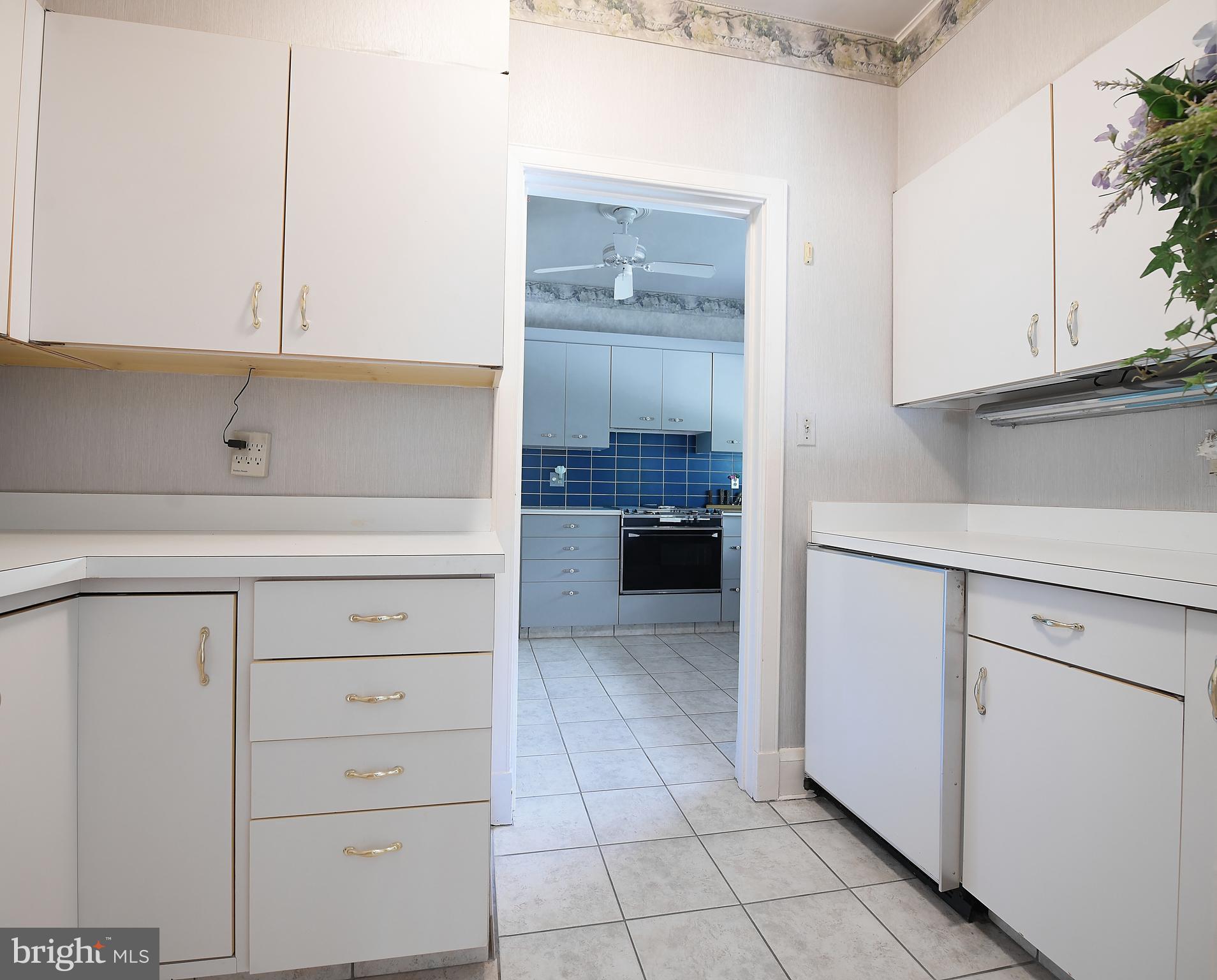 213 Kemble Road Baltimore, MD 21218 - Photo 21 of 66 Butler's Pantry Located Between DR and Kitchen