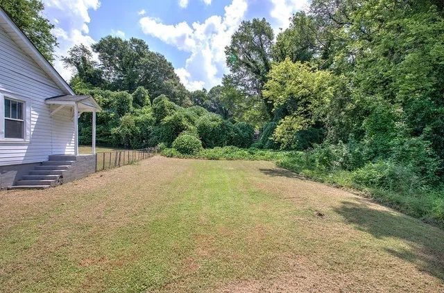 a view of a backyard of the house