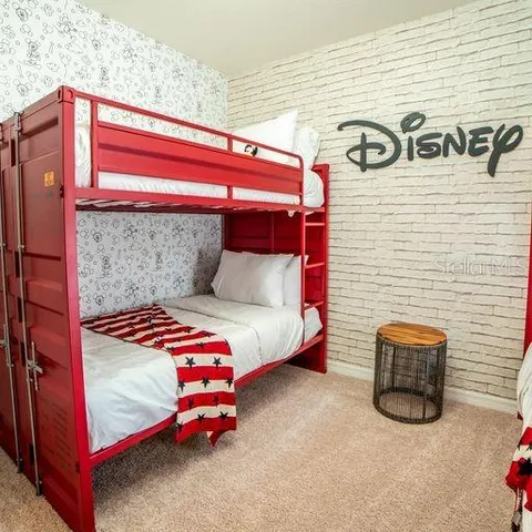 a bathroom with a granite countertop sink and white cabinets
