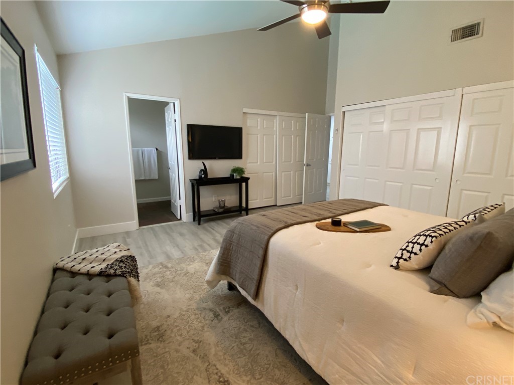 9960 Owensmouth Avenue, Unit 25 Chatsworth, CA 91311 - Photo 11 of 17 a bedroom with a bed and a television