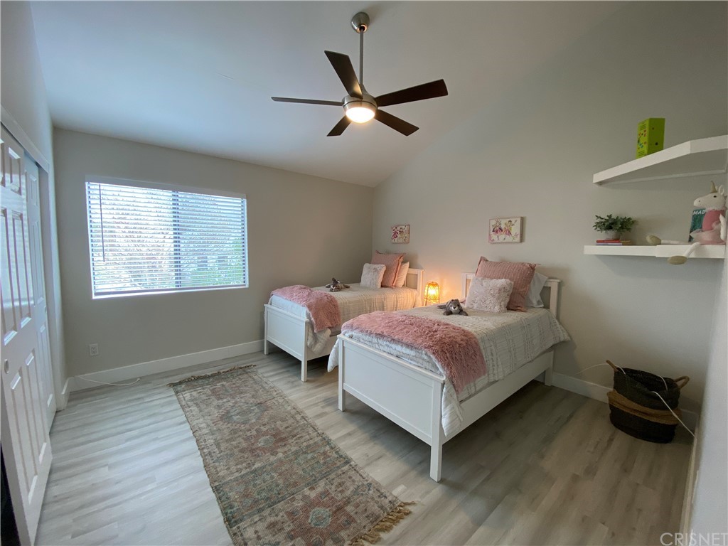 9960 Owensmouth Avenue, Unit 25 Chatsworth, CA 91311 - Photo 13 of 17 a bedroom with a bed and a window