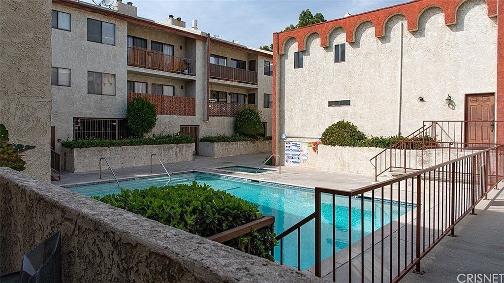 9960 Owensmouth Avenue, Unit 25 Chatsworth, CA 91311 - Photo 16 of 17 a view of a street with cars parked in front of it