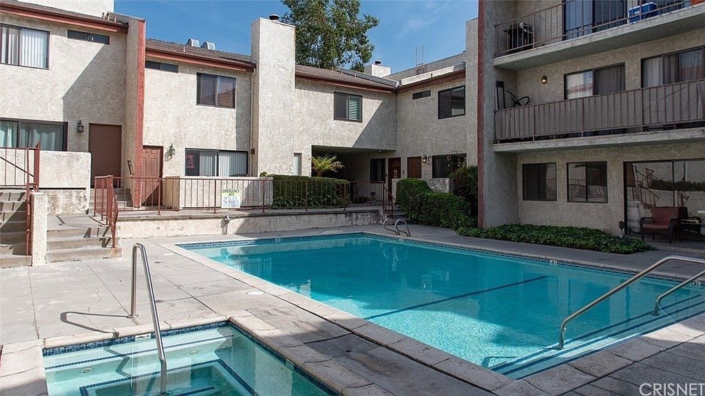 9960 Owensmouth Avenue, Unit 25 Chatsworth, CA 91311 - Photo 17 of 17 a view of a house with swimming pool