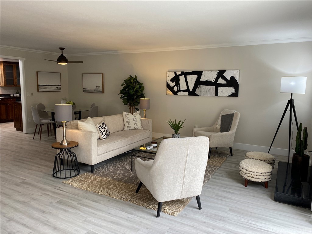 9960 Owensmouth Avenue, Unit 25 Chatsworth, CA 91311 - Photo 3 of 17 a living room with furniture and a wooden floor