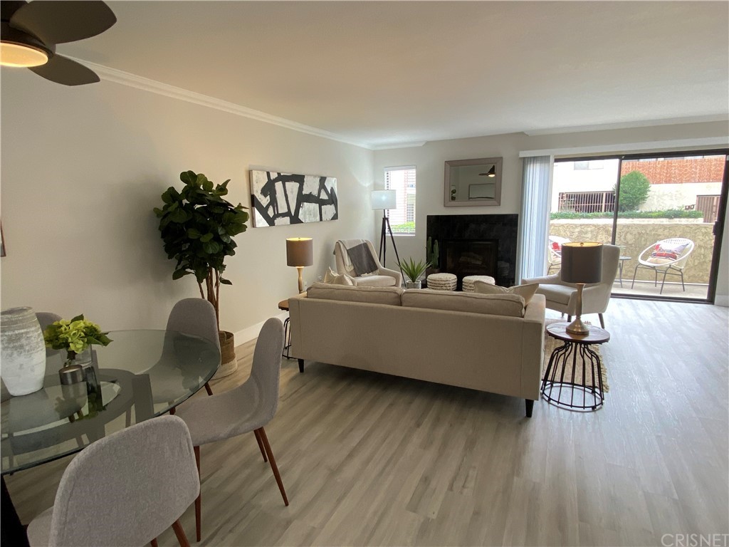 9960 Owensmouth Avenue, Unit 25 Chatsworth, CA 91311 - Photo 4 of 17 a living room with furniture and a flat screen tv
