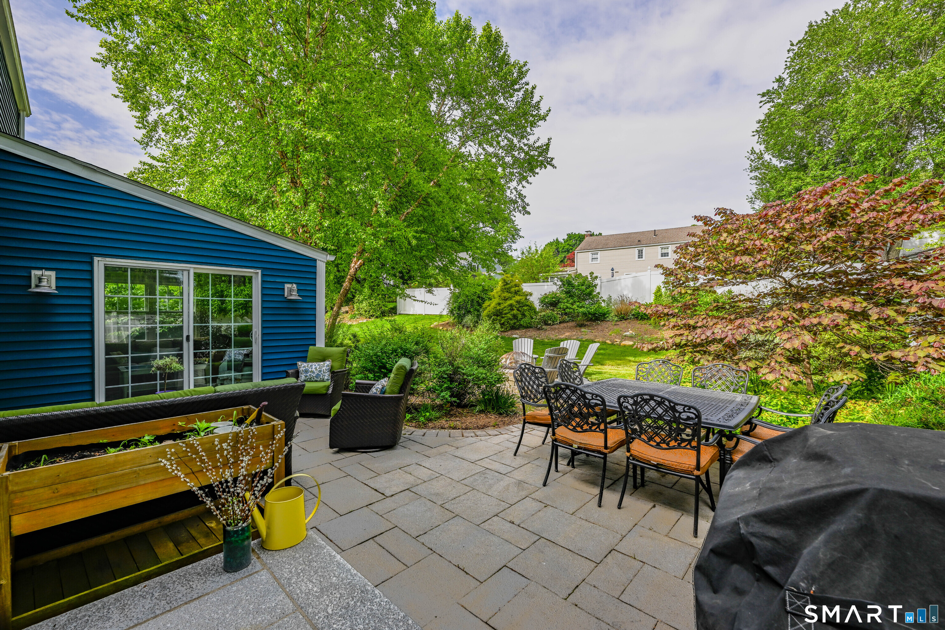 47 Spring Lane West Hartford, CT 06107 - Photo 34 of 38 a view of a lounge chairs in the back yard of the house