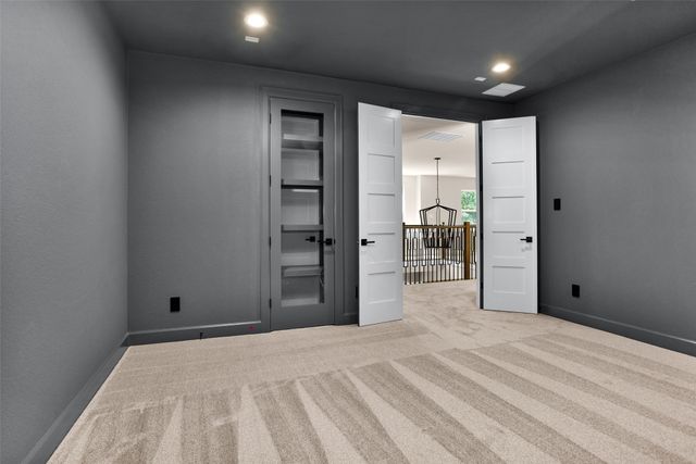 a view of a room with closet and mirror