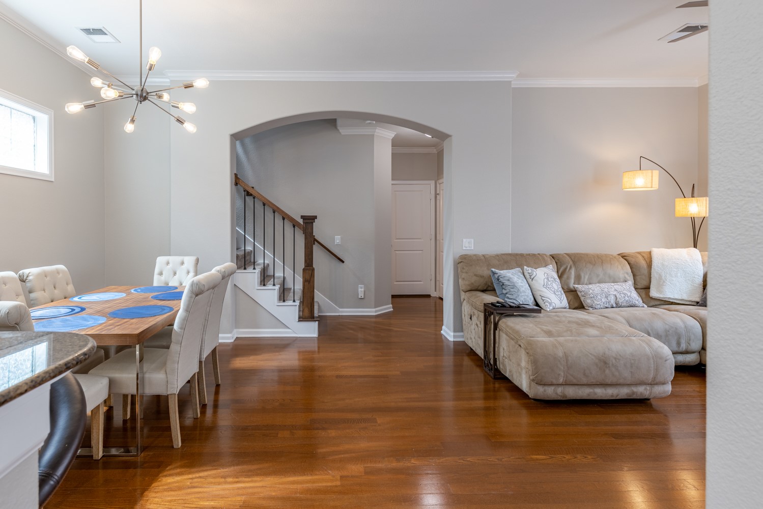 5208 Petty Street, Unit D Houston, TX 77007 - Photo 11 of 39 a living room with furniture and a chandelier