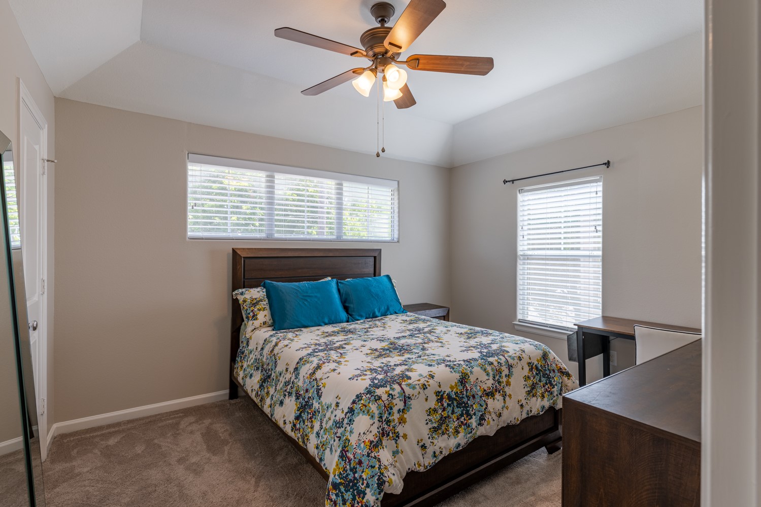 5208 Petty Street, Unit D Houston, TX 77007 - Photo 18 of 39 a bed sitting in a bedroom next to a window