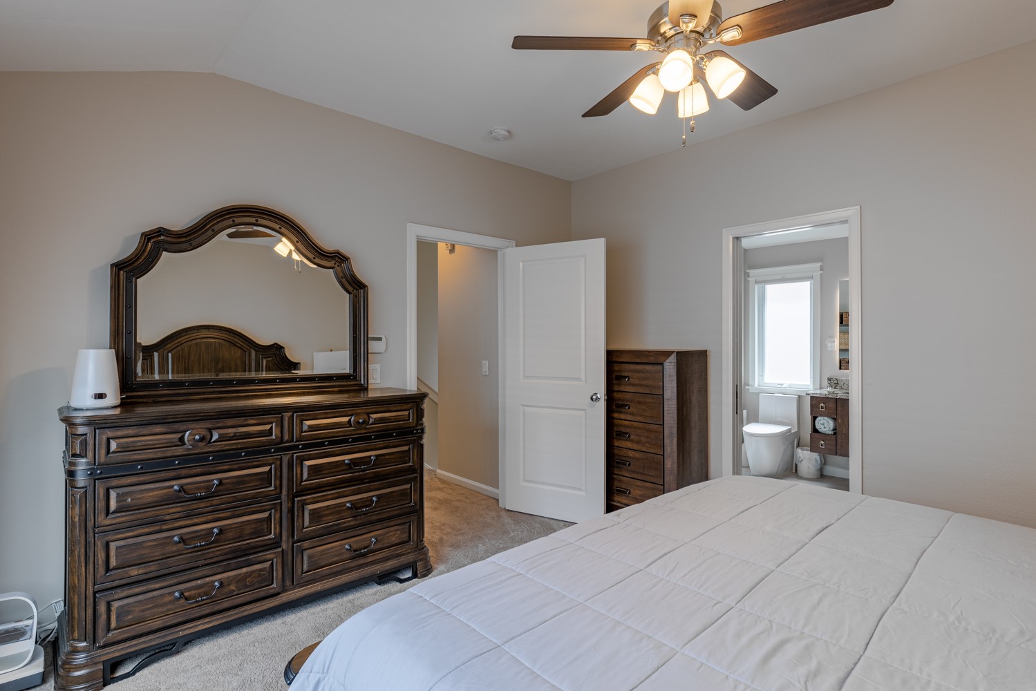 5208 Petty Street, Unit D Houston, TX 77007 - Photo 26 of 39 a bedroom with a bed and a dresser