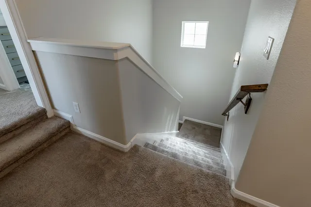 a view of an empty room with stairs