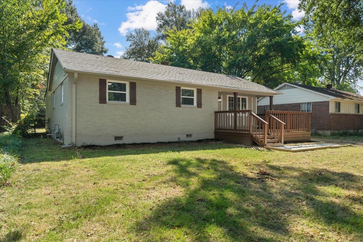 524 McDermitt Road Memphis, TN 38120 - Photo 24 of 32 Rear exterior featuring a wood deck, brick siding, and a gabled roof
