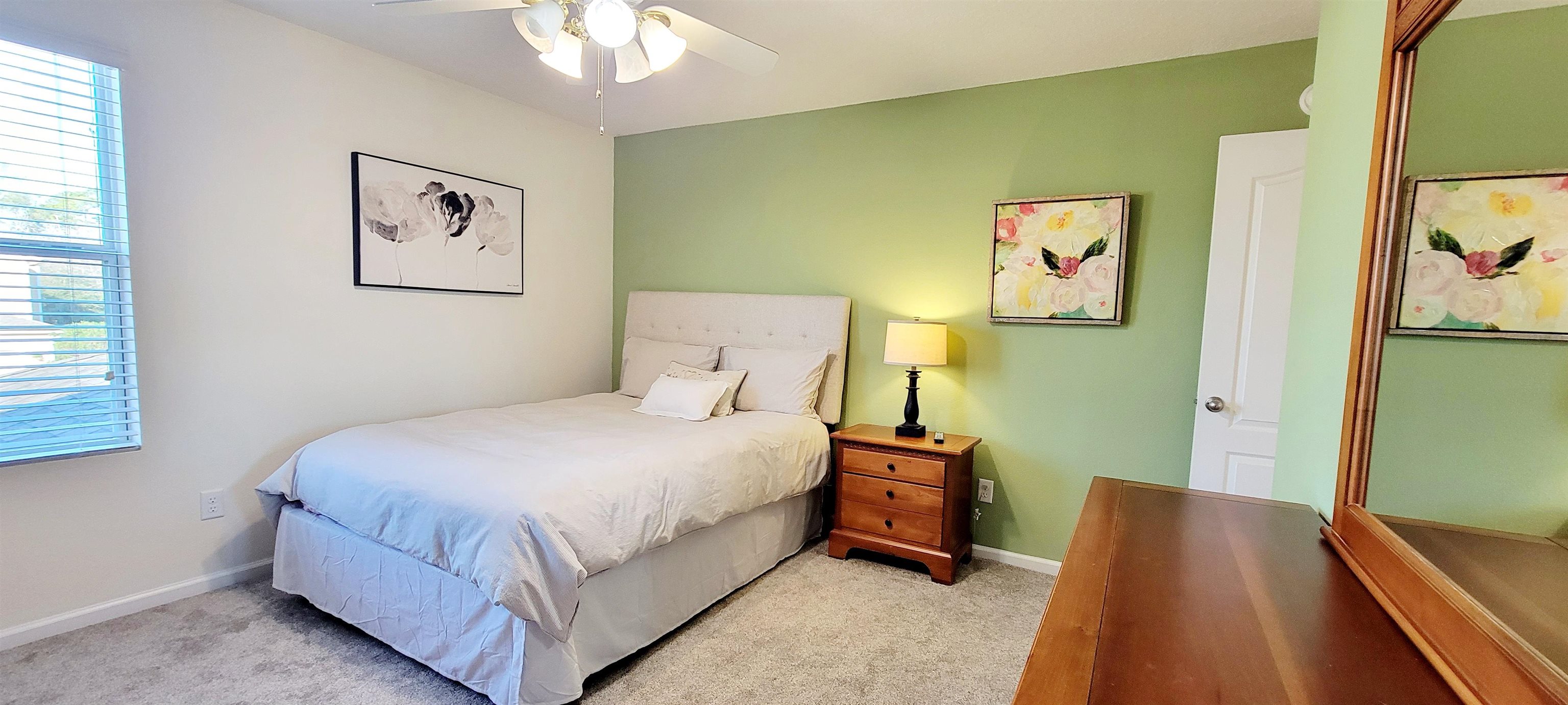 82 Whitland Way St. Augustine, FL 32086 - Photo 13 of 24 a bedroom with a bed and a flat screen tv