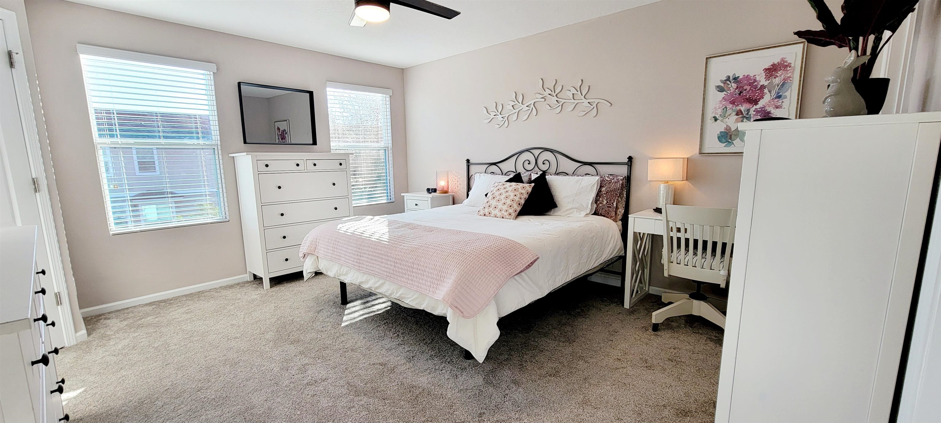 82 Whitland Way St. Augustine, FL 32086 - Photo 17 of 24 a bedroom with a bed a flat screen tv and dresser