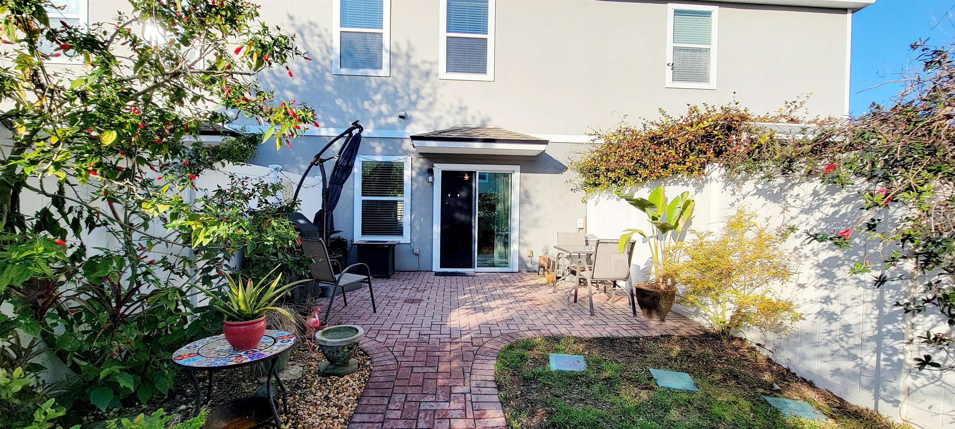 82 Whitland Way St. Augustine, FL 32086 - Photo 23 of 24 a front view of a house with a yard