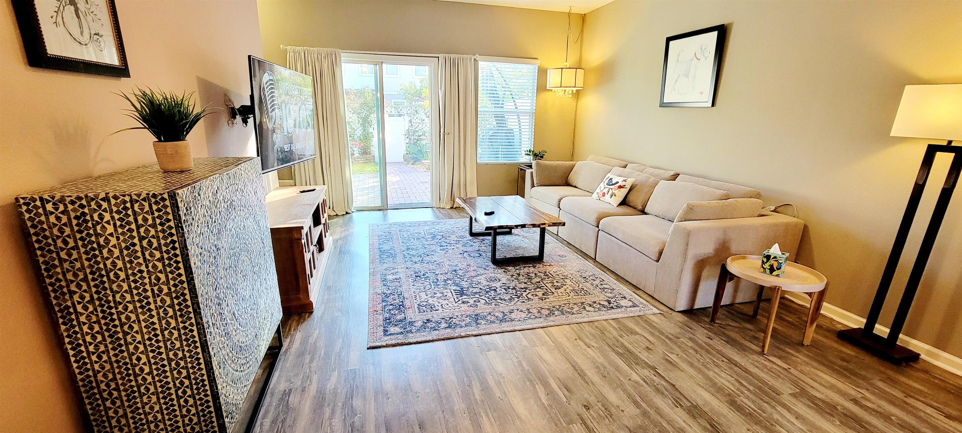 82 Whitland Way St. Augustine, FL 32086 - Photo 9 of 24 a living room with furniture and a floor to ceiling window