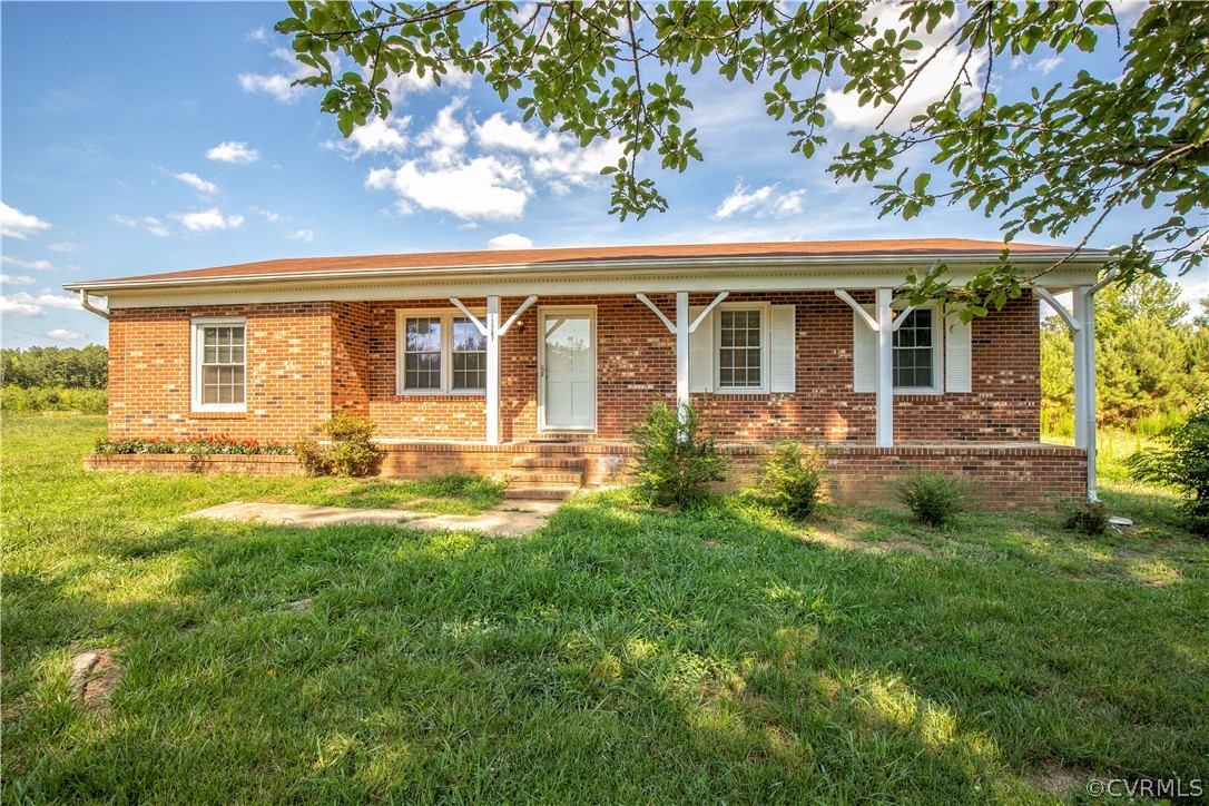12207 Baltimore Road Ford, VA 23850 - Photo 1 of 24 a front view of a house with garden