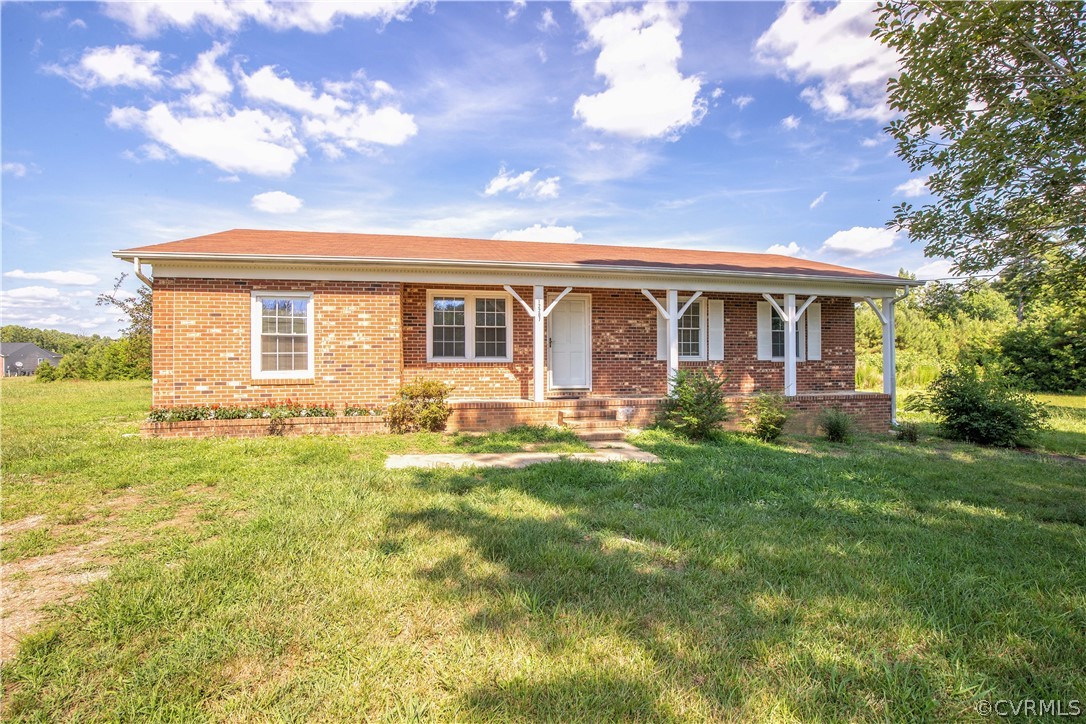 12207 Baltimore Road Ford, VA 23850 - Photo 6 of 24 front view of a house with a yard
