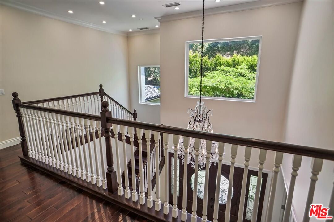 1701 Roscomare Road Los Angeles, CA 90077 - Photo 23 of 45 a view of a porch with wooden floor