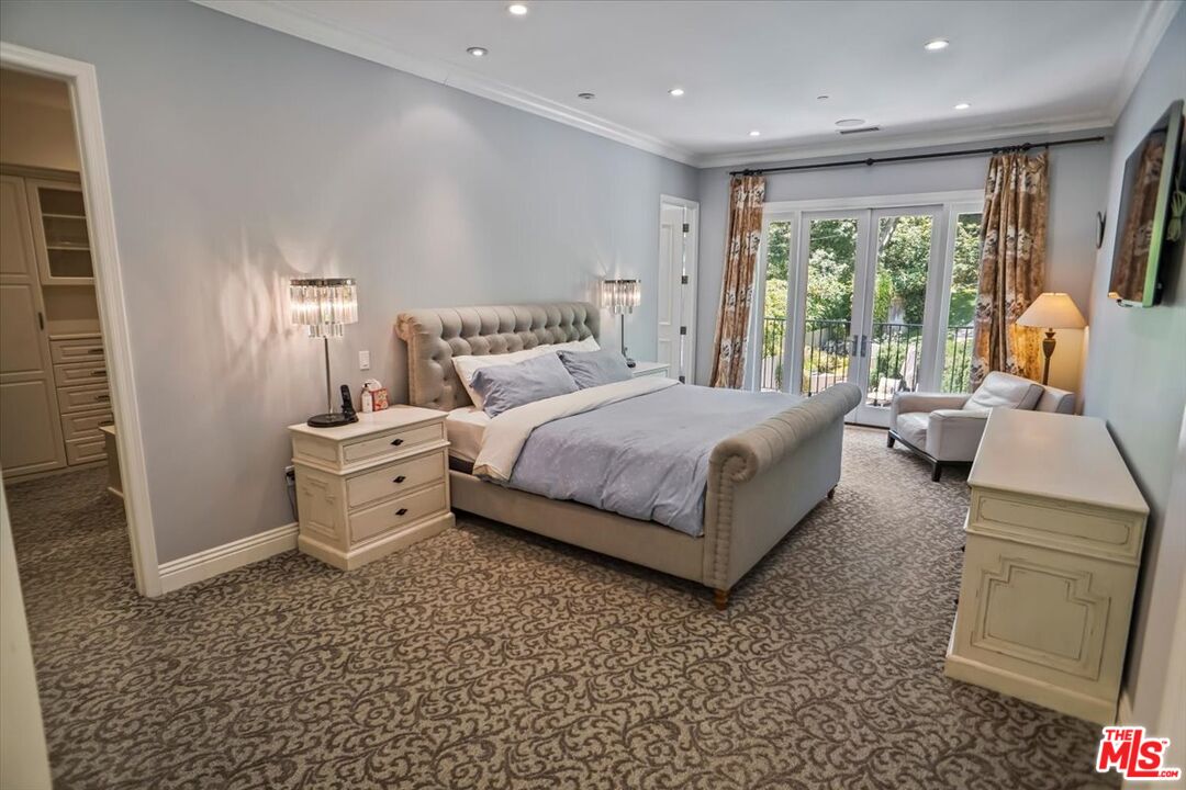 1701 Roscomare Road Los Angeles, CA 90077 - Photo 24 of 45 a bed room with a bed and a large window