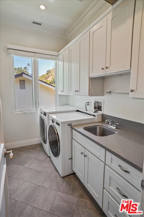 1701 Roscomare Road Los Angeles, CA 90077 - Photo 36 of 45 a utility room with sink dryer and washer