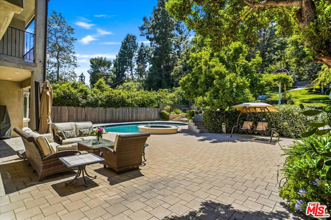 1701 Roscomare Road Los Angeles, CA 90077 - Photo 37 of 45 a view of a patio with table and chairs and potted plants