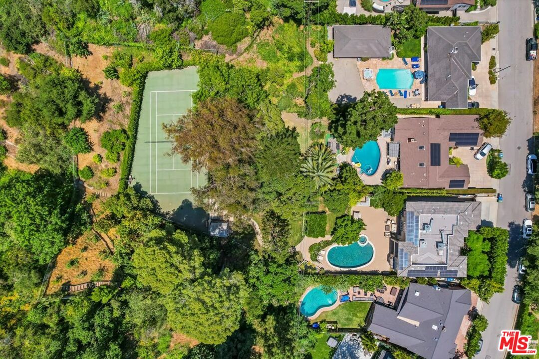 1701 Roscomare Road Los Angeles, CA 90077 - Photo 6 of 45 an aerial view of a house with a yard and lake view