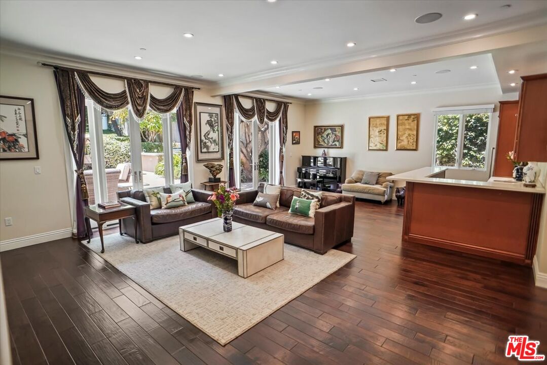 1701 Roscomare Road Los Angeles, CA 90077 - Photo 8 of 45 a living room with furniture and a large window