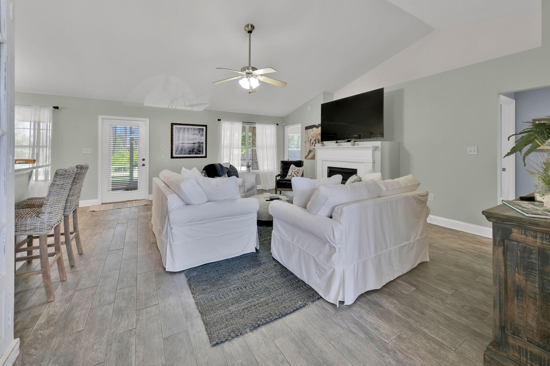 552 East Shipwreck Road Santa Rosa Beach, FL 32459 - Photo 8 of 38 a living room with furniture and a flat screen tv