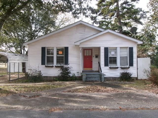 111 3rd Street Minden, LA 71055 - Photo 1 of 1 a front view of a house with a yard and outdoor seating