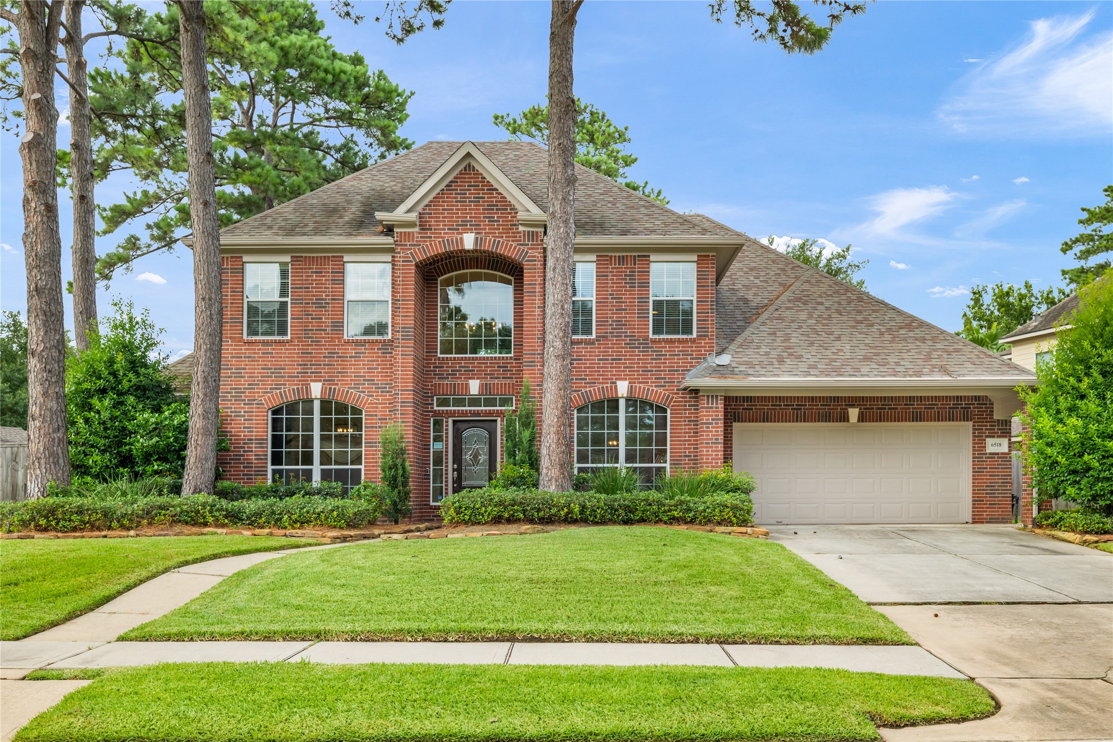 6518 Briarstone Lane Spring, TX 77379 - Photo 2 of 46 An extravagant walkway leads to the front entrance, offering a grand first impression and room to design your own custom garden retreat.