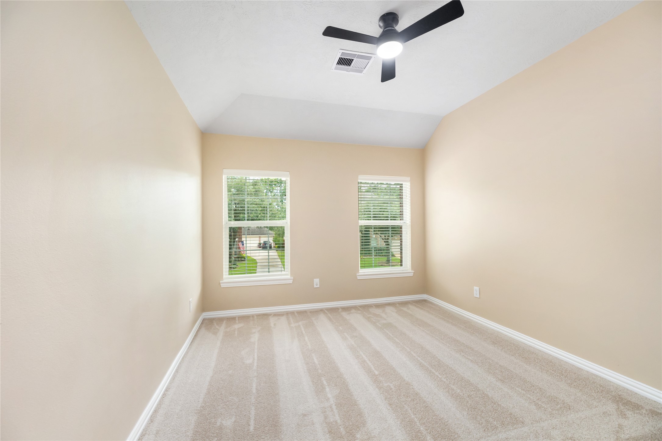 6518 Briarstone Lane Spring, TX 77379 - Photo 33 of 46 Carpeted flooring, a high ceiling fan, and double windows give this room a cozy yet comfortable feel with plenty of natural light.