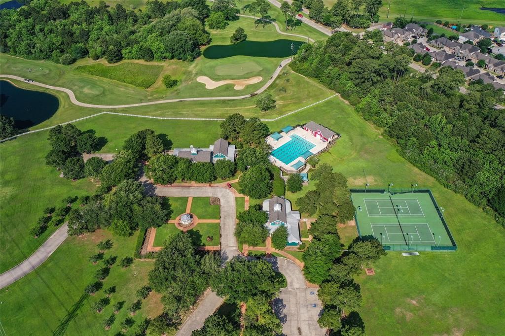 6518 Briarstone Lane Spring, TX 77379 - Photo 41 of 46 Residents enjoy access to a sparkling pool, inviting clubhouse, scenic walking trails, and a spacious 22-acre central park perfect for outdoor activities and gatherings.