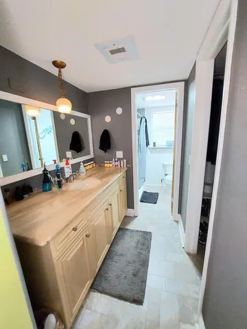 a room with sink washer and dryer