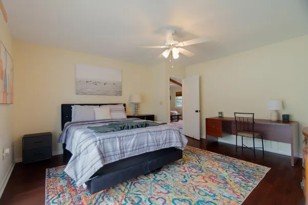 a bedroom with a bed and a table in it