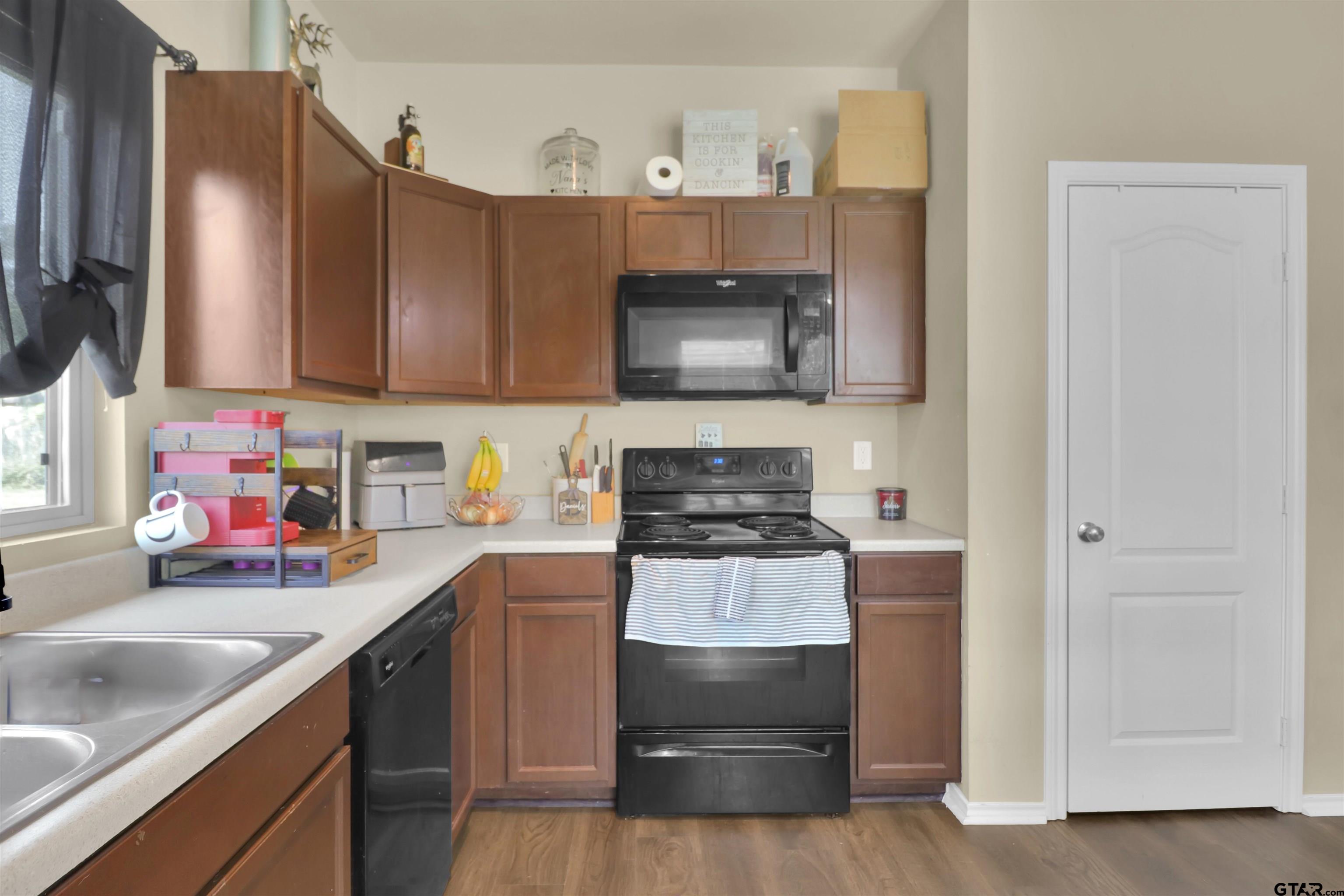 514 County Road 1201 Rusk, TX 75785 - Photo 11 of 29 a kitchen with a sink stove and refrigerator