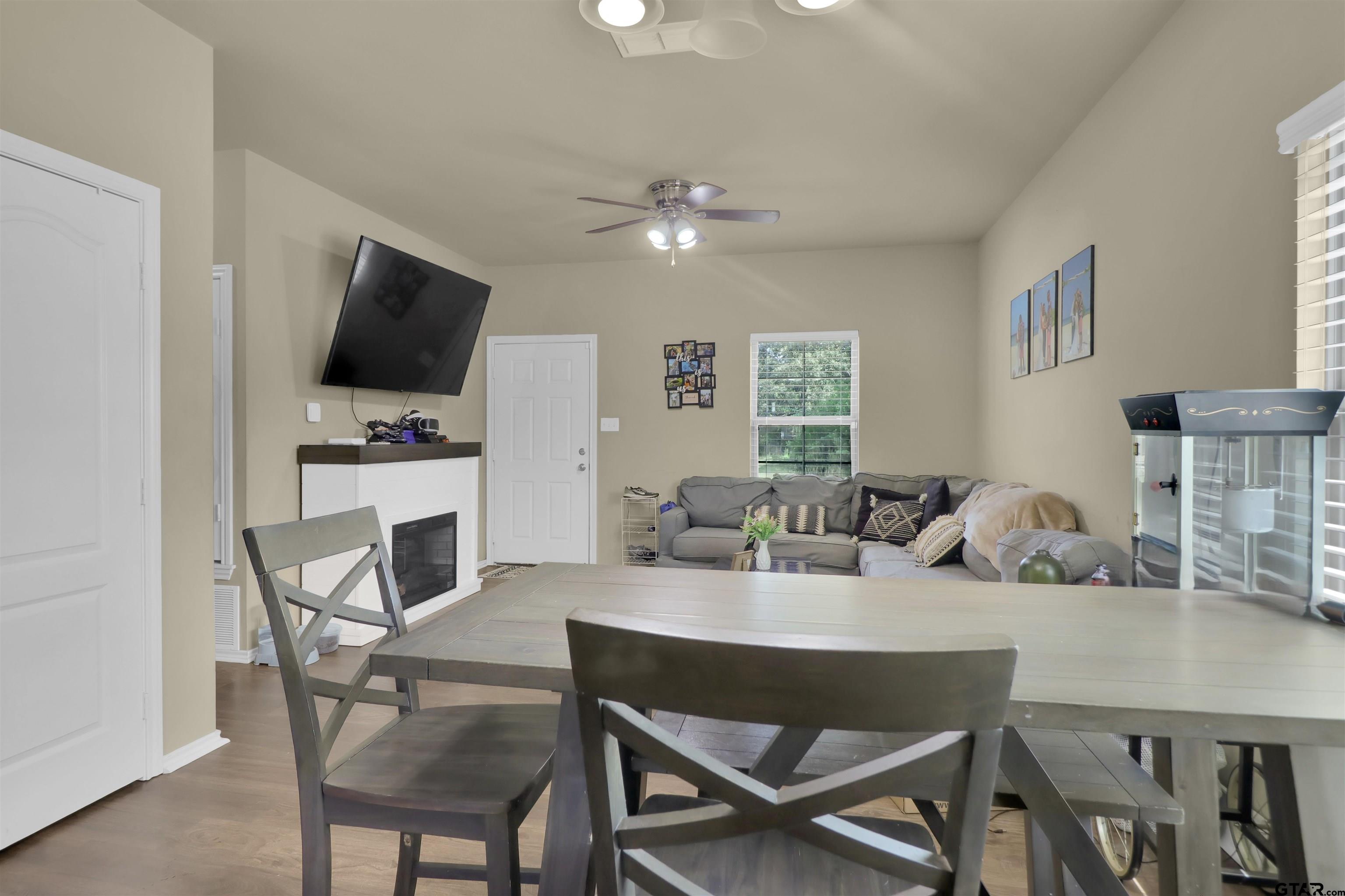 514 County Road 1201 Rusk, TX 75785 - Photo 12 of 29 a view of a dining room with furniture and a flat screen tv