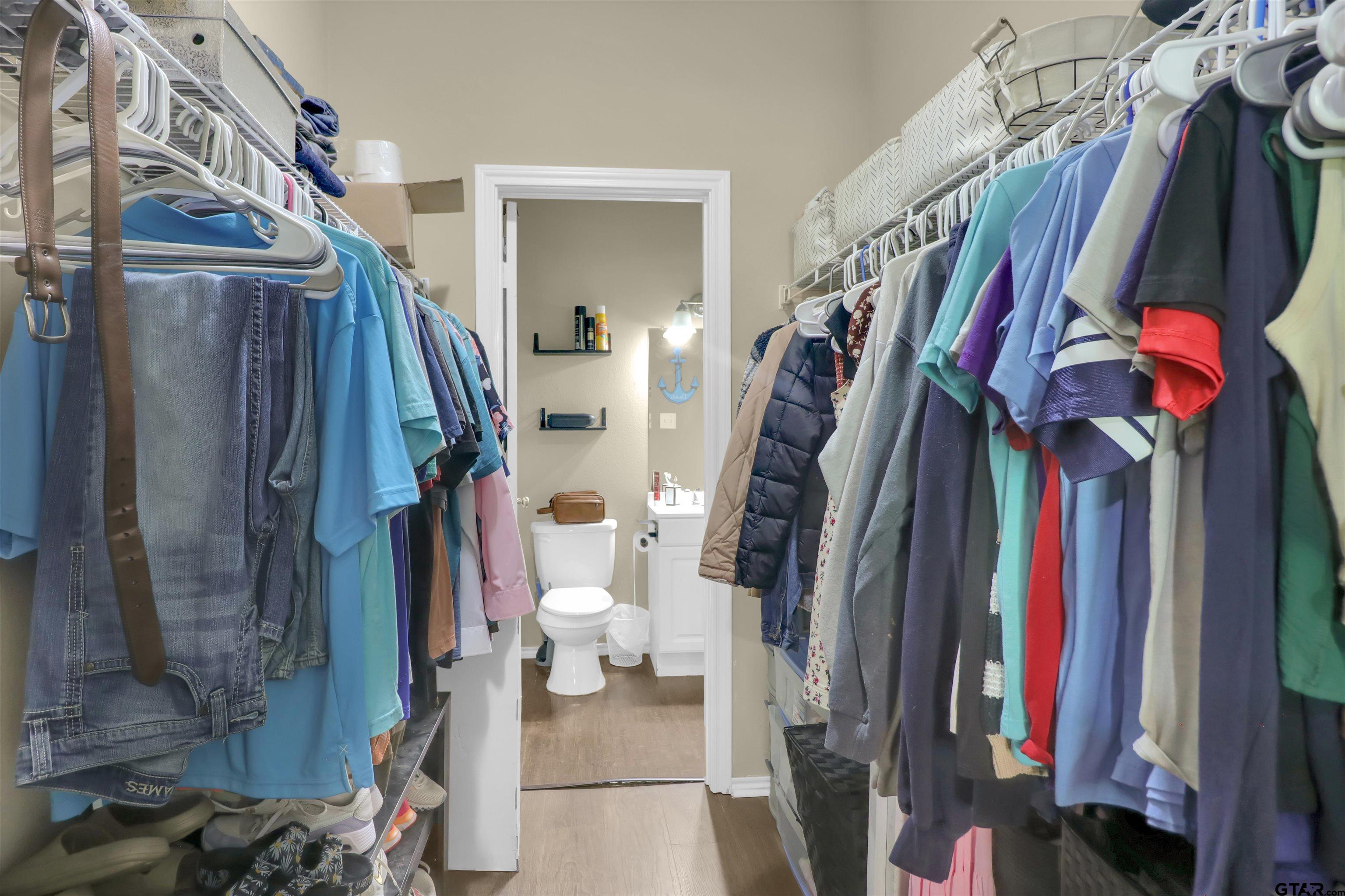 514 County Road 1201 Rusk, TX 75785 - Photo 18 of 29 a view of walk in closet with clothes and shoes