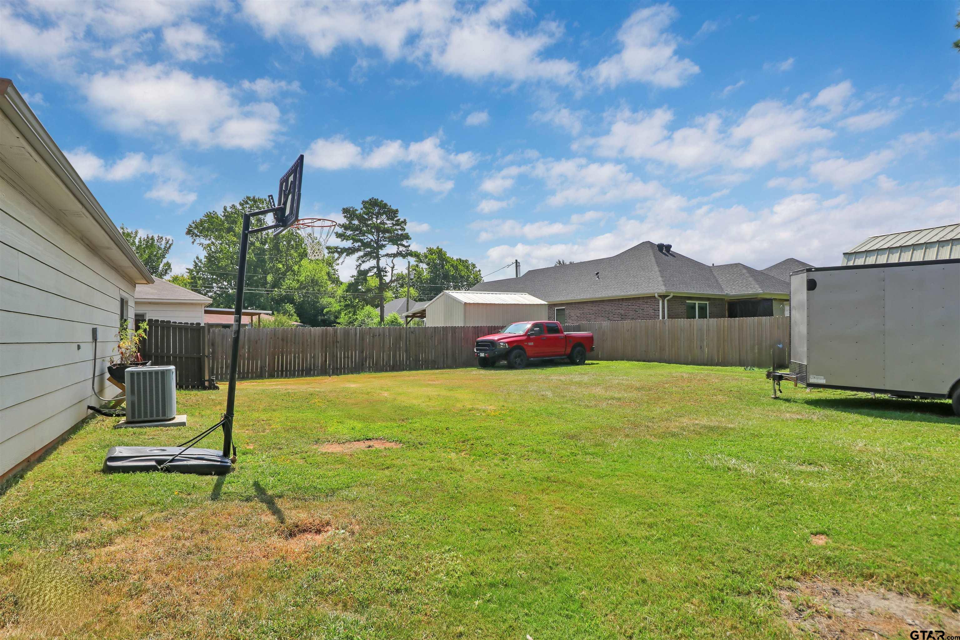 514 County Road 1201 Rusk, TX 75785 - Photo 24 of 29 a backyard of a house with table and chairs