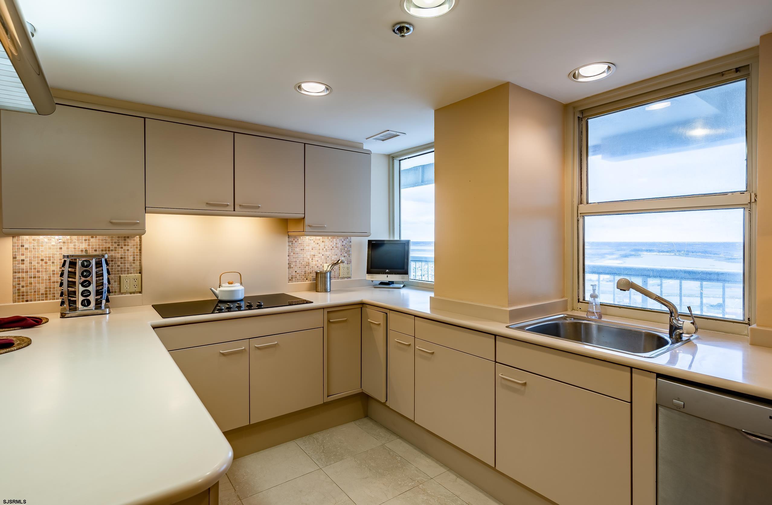3101 Boardwalk, Unit CONDO Atlantic City, NJ 08401 - Photo 16 of 46 a kitchen with sink and cabinets